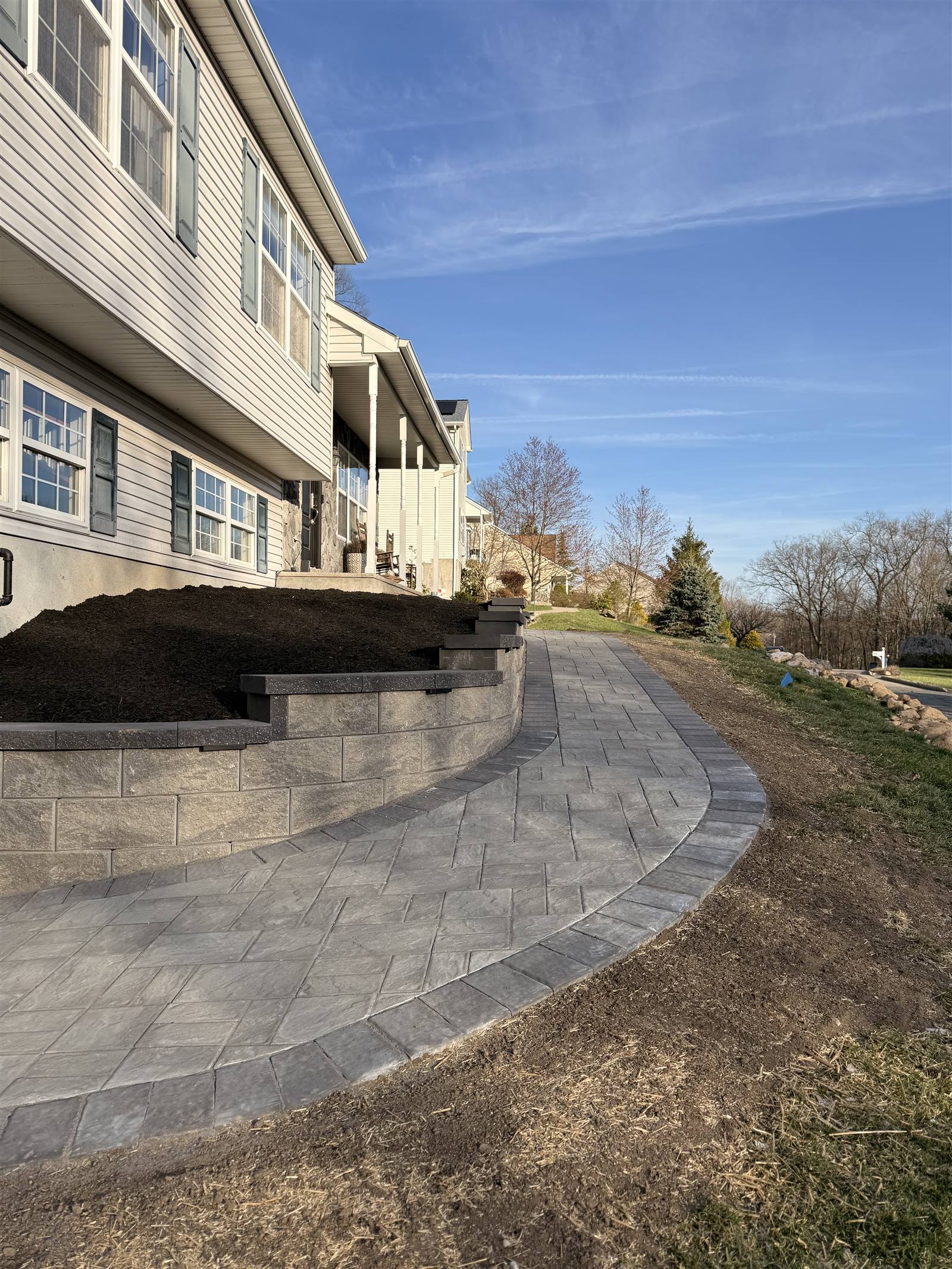 Paver patio and steps with retaining wall